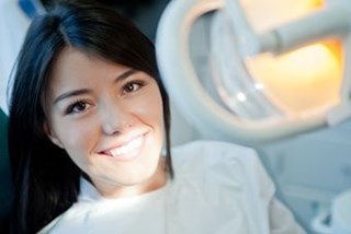 Young woman portrait visiting the dentist and smiling.jpg